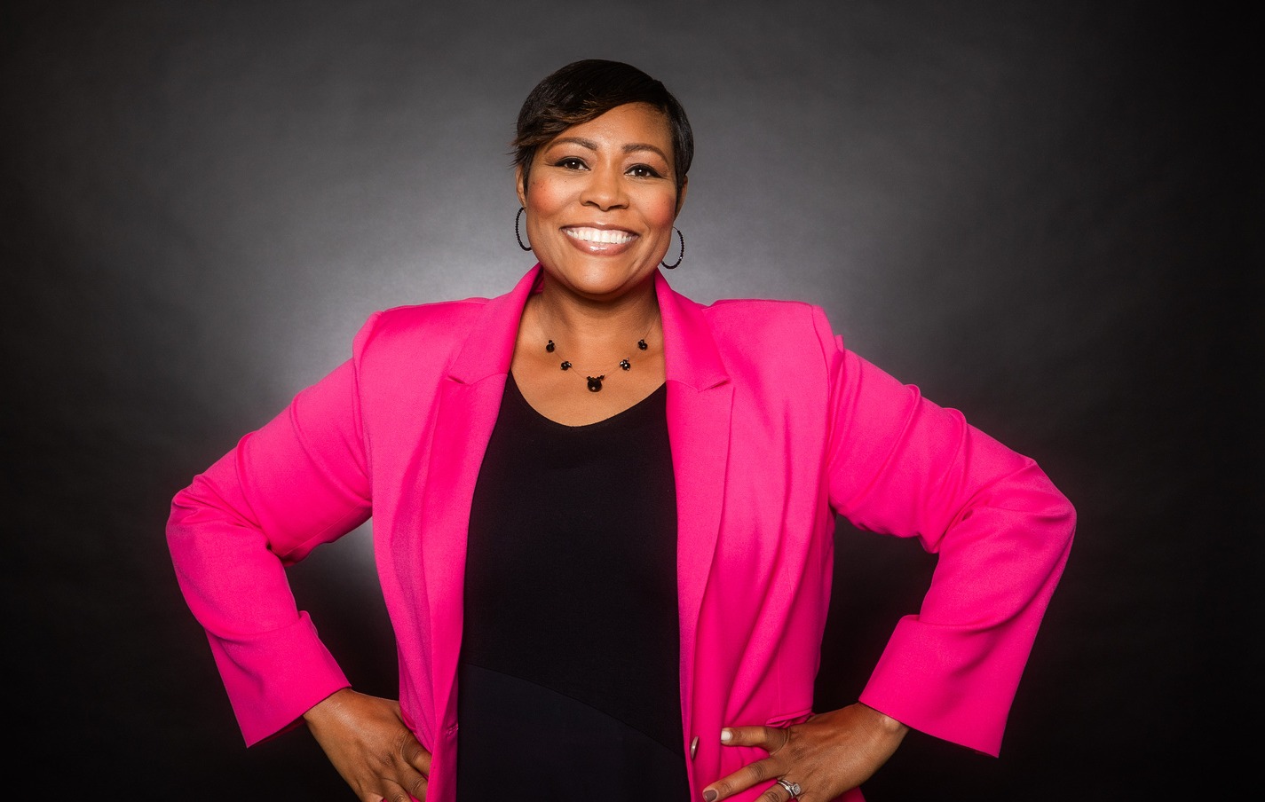 black women in pink blazer