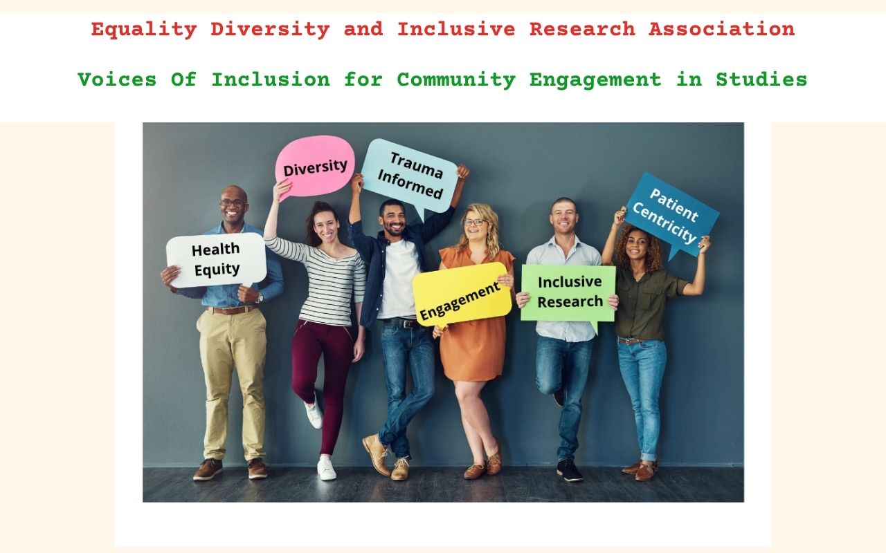 A group of people from diverse backgrounds standing infront of a wall holding signs