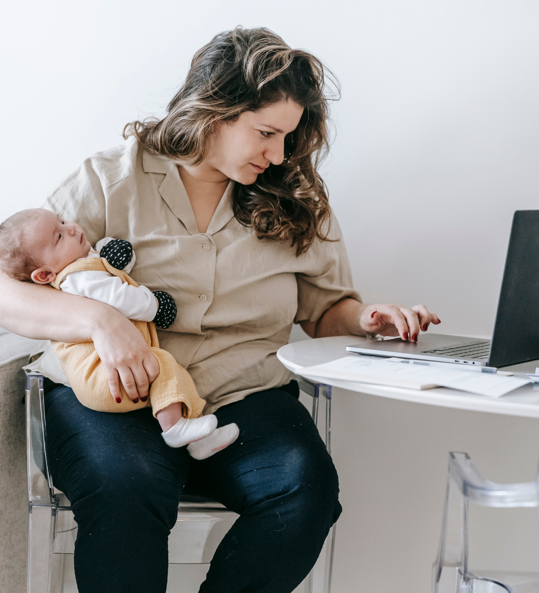 mom getting support from telehealth provider while holding baby
