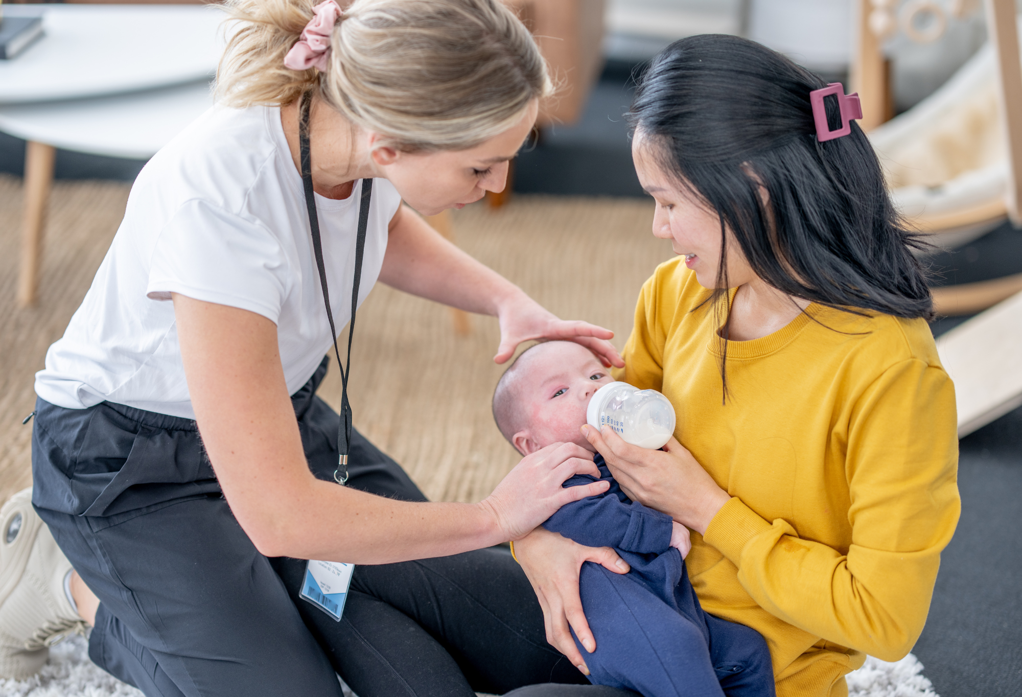 PBH-C IBCLC helping mom feed baby