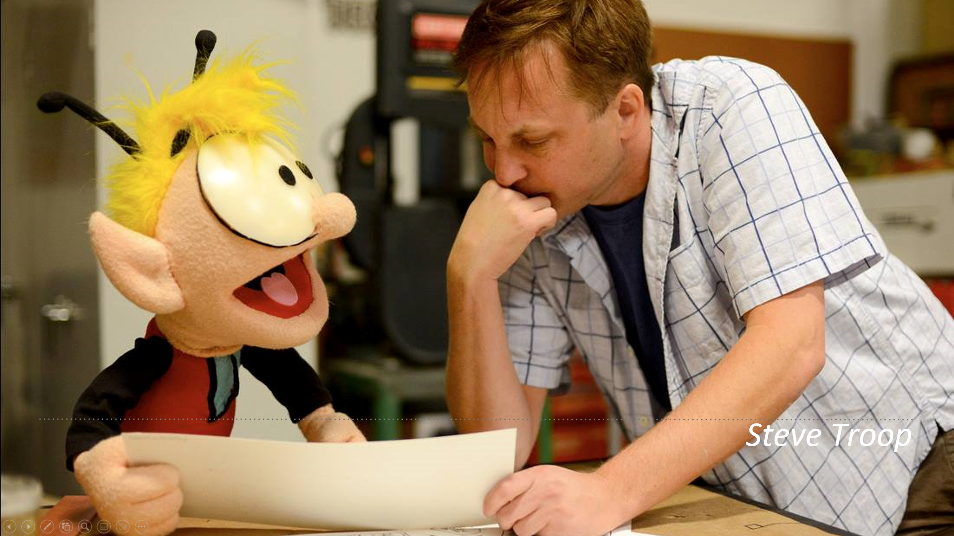 Steve Troop (right) going over a design with his friend (and creation). 