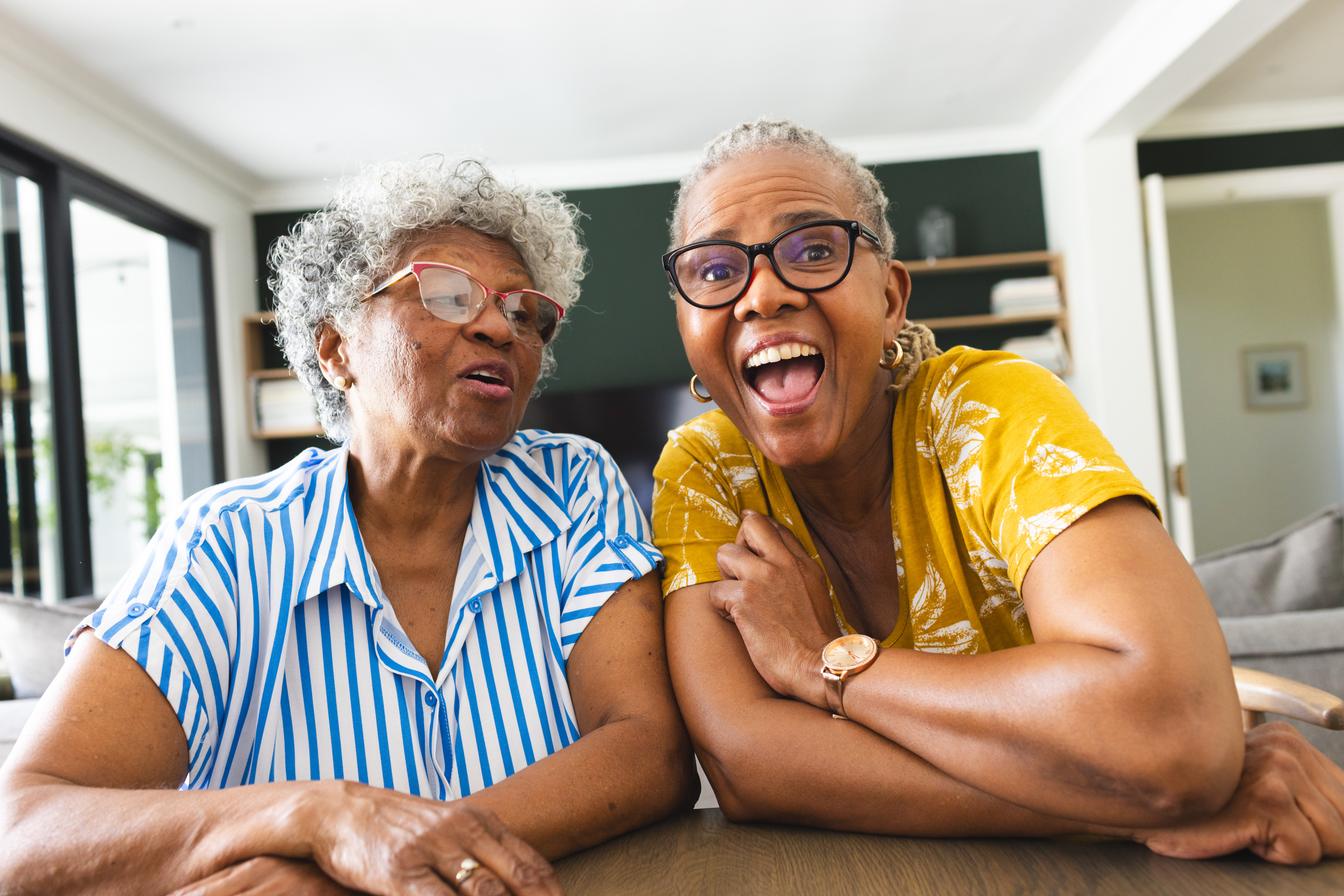 Two African American women enjoying their new AI skills