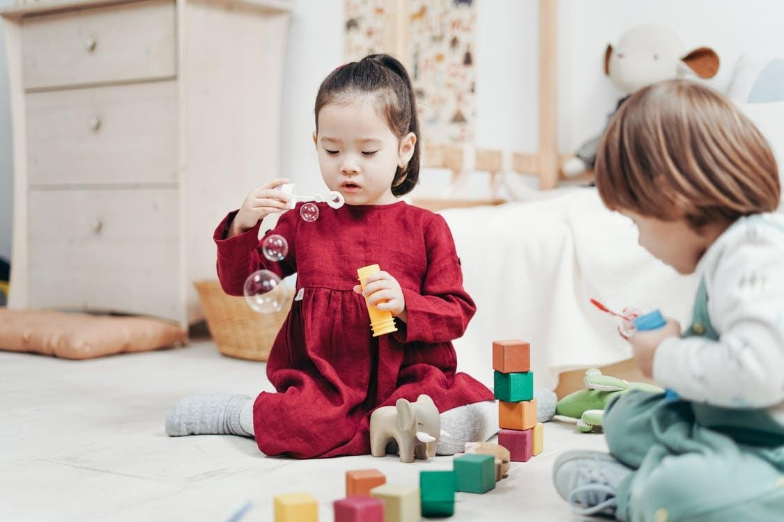 Toddlers playing indoors