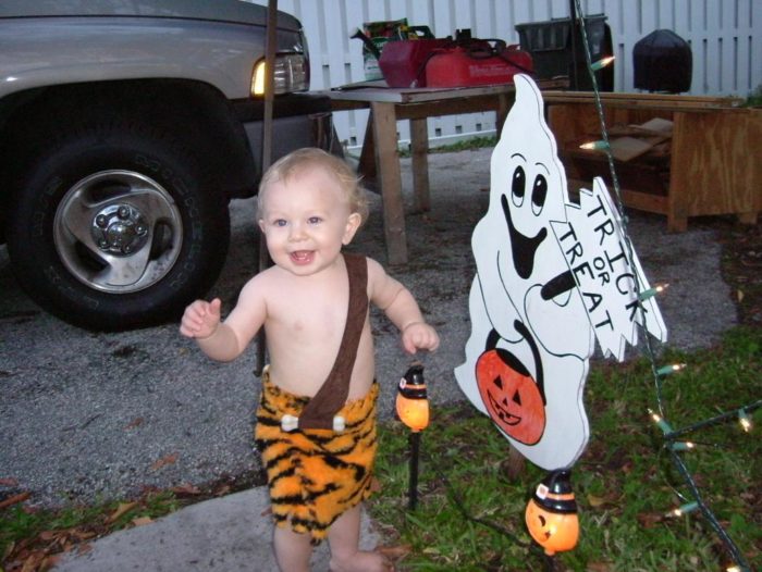 this is a costume i made for my son for his first halloween its made out of fun fur and has a faux suede shoulder strap i used plastic bones sewn on