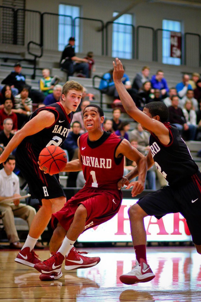 Rookie Patrick Steeves (left) led all scorers with 14 points Saturday. Fellow rookie Siyani Chambers handled point guard duties for the Crimson team.