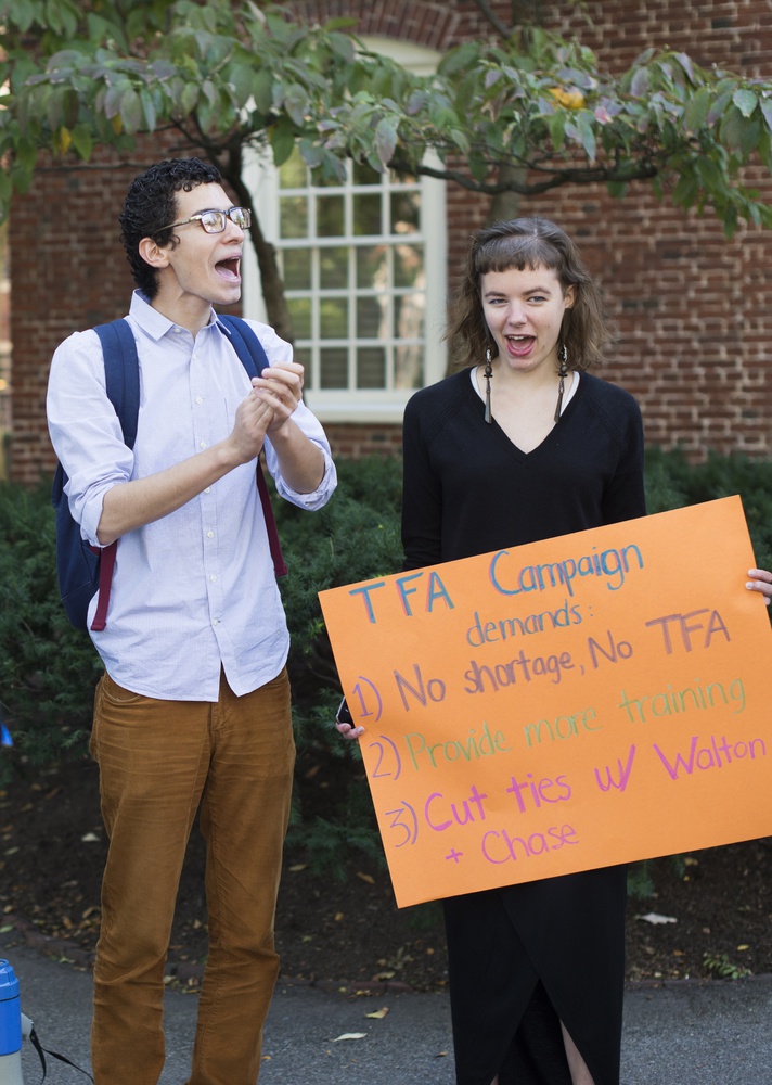 Chanting "education not privatization," Gabriel H. Bayard '15 and Hannah L. McShea '18 protest Teach For America on Friday, Sept. 26 outside Massachusetts Hall.