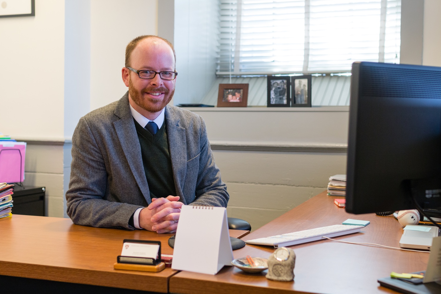 Associate Dean of Student Life David R. Friedrich poses for a photo in his office in University Hall. Friedrich noted that the Office of Student Life is trying to help students with responsible travel plans.