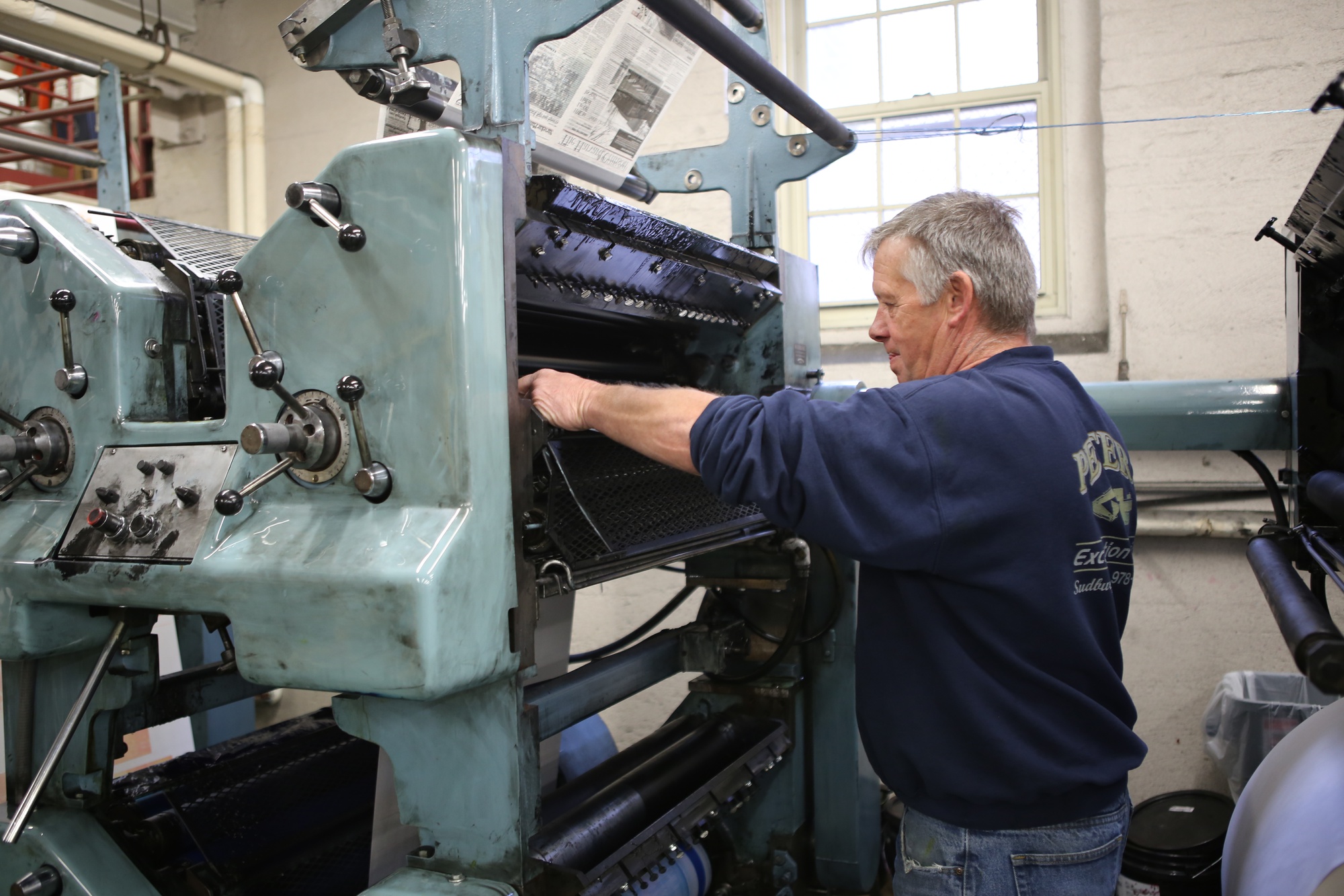Brian Byrne runs the press in the basement of the 14 Plympton Street. Byrne is the only person in the entirety of the Crimson who knows how to run the press, and started the job in 1981 at age 26