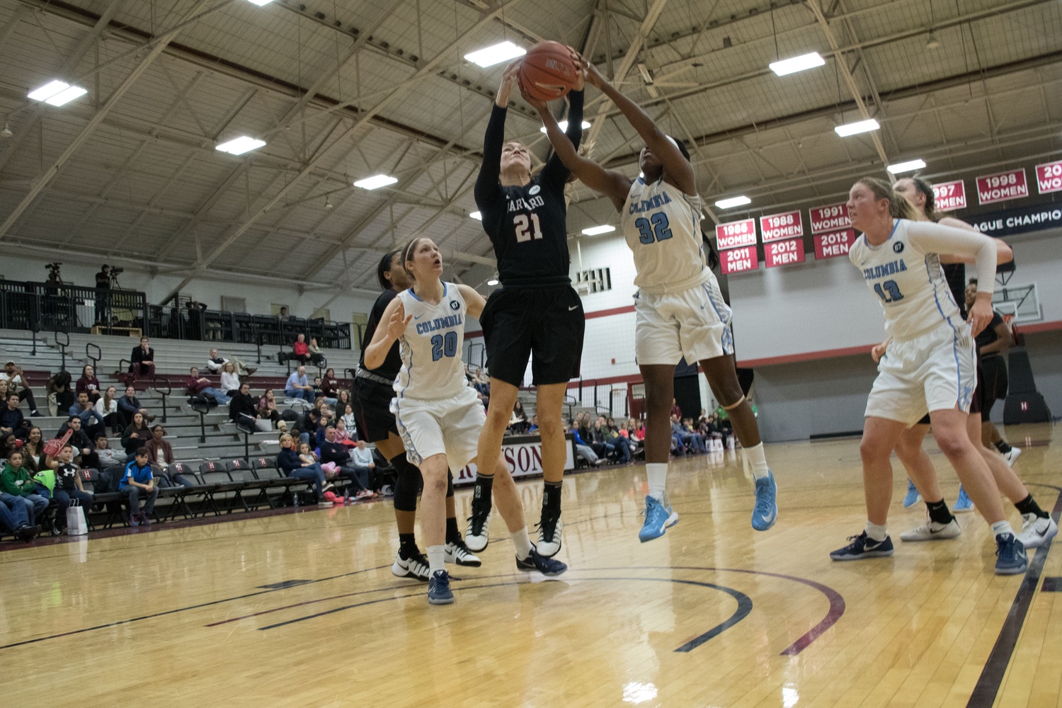 Senior captain Taylor Finley fights Columbia's Tori Oliver for a rebound in the Crimson's narrow win over the Lions. 