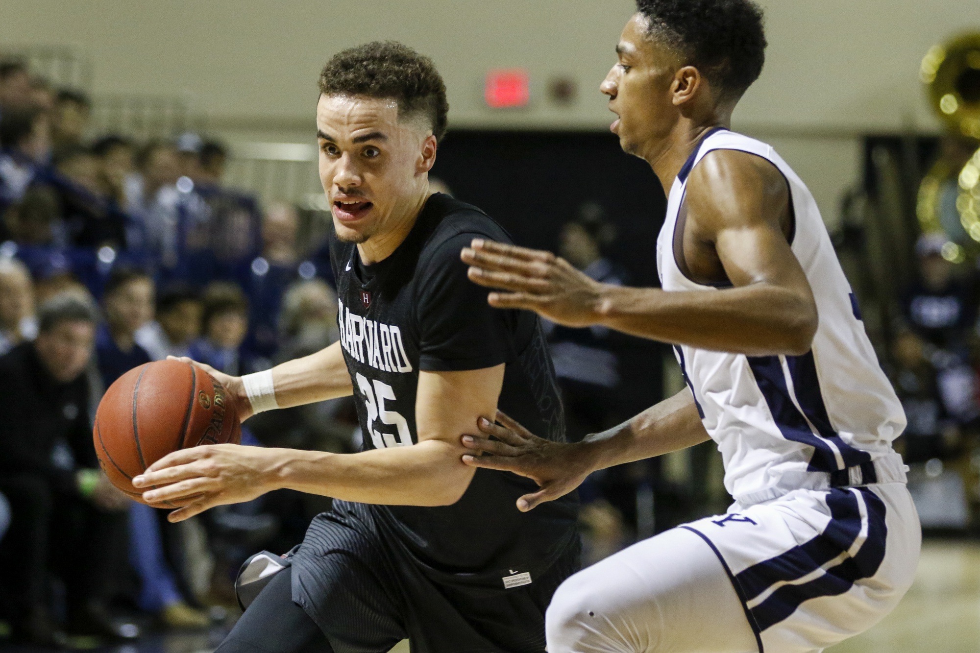 Junior guard Corey Johnson drives past a Yale defender last weekend. 