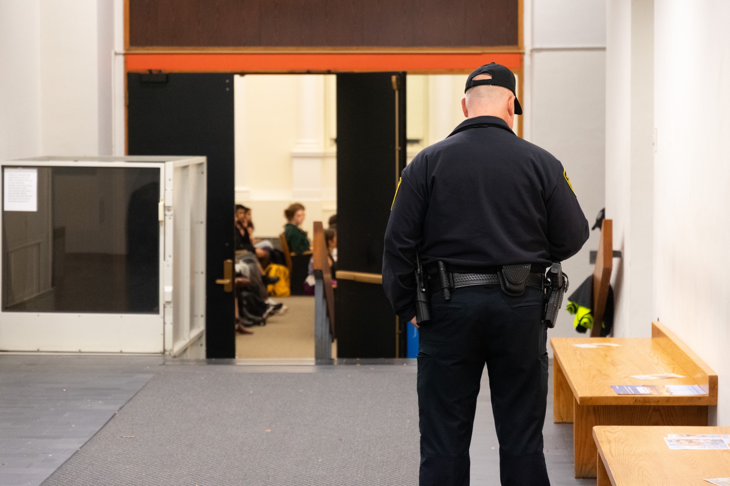 More than a dozen Harvard University Police officers were stationed around Harvard Yard on Monday, checking student IDs at entrances to the Yard. Officers were also stationed inside Emerson Hall, where the event took place.