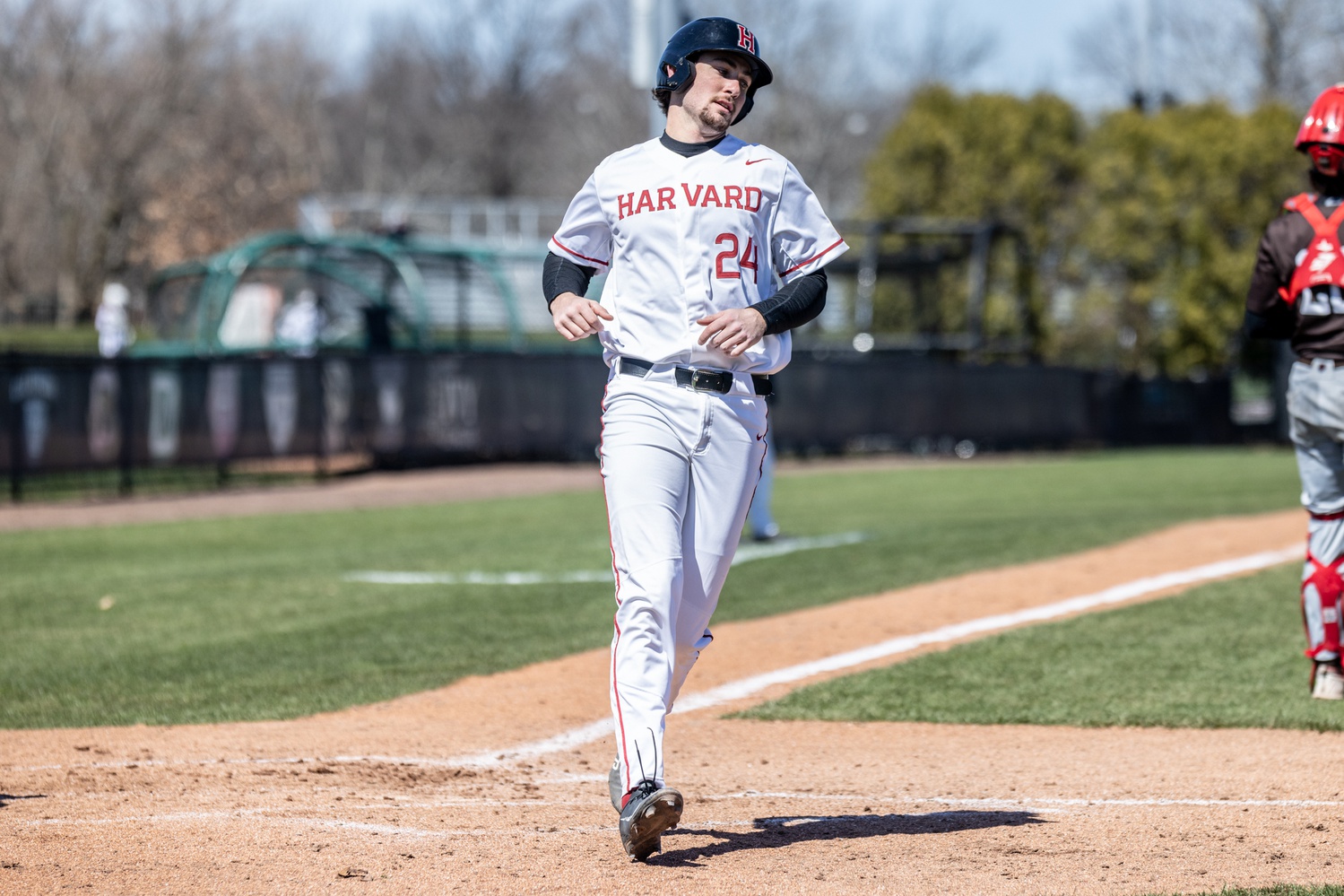 Then-sophomore catcher Zach Brown crosses home plate against Brown on April 2, 2022 against Brown.