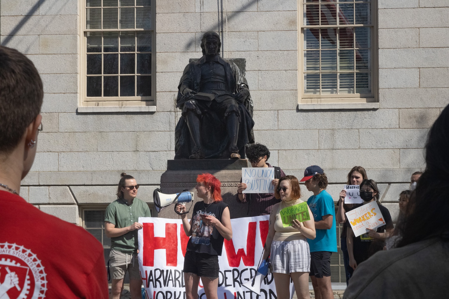 Harvard Undergraduate Workers Union organizer Syd D. Sanders ’24 addresses rally attendees.