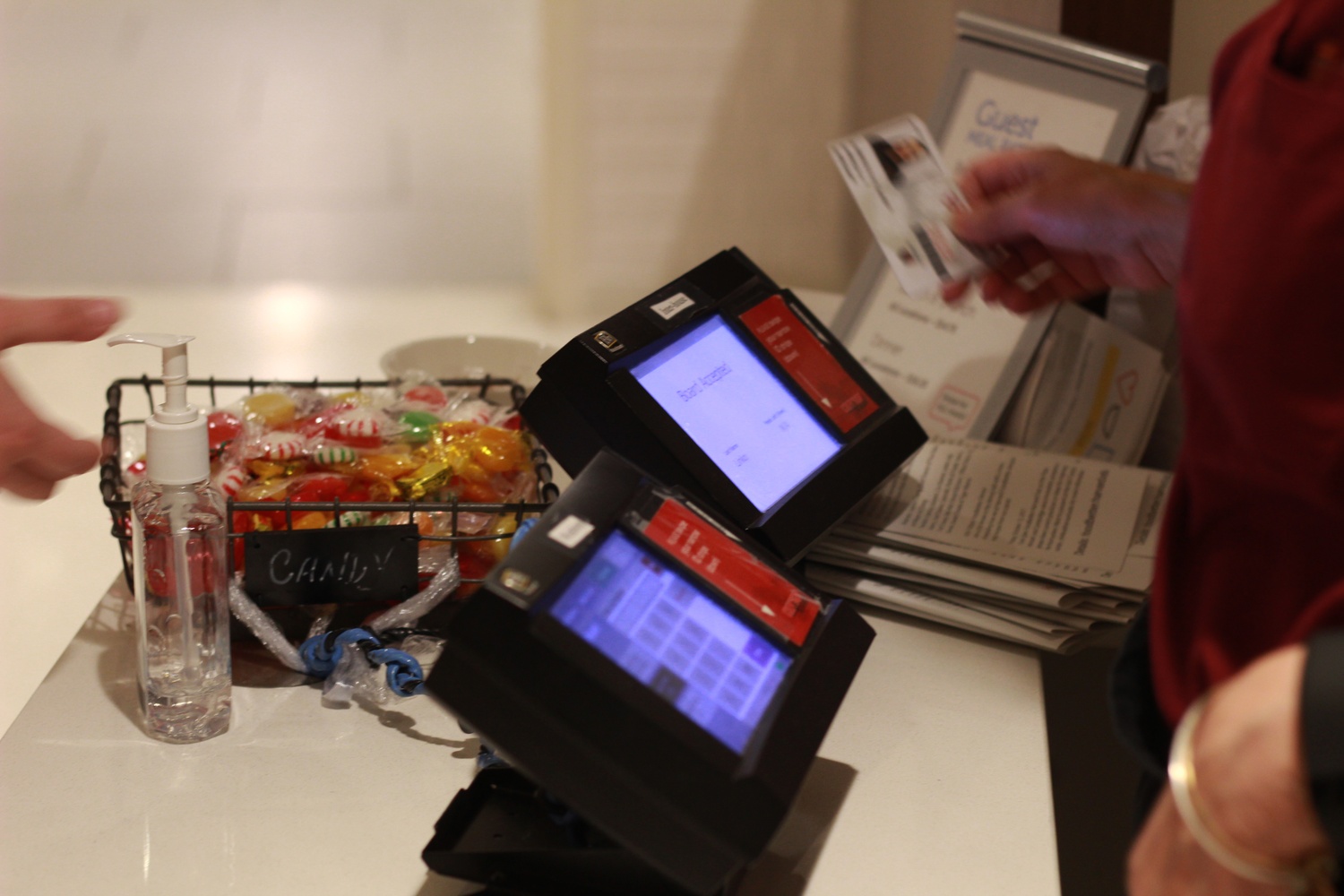 A HUDS staff member swipes a non-Winthrop student into the Winthrop dining hall during Sunday afternoon brunch.