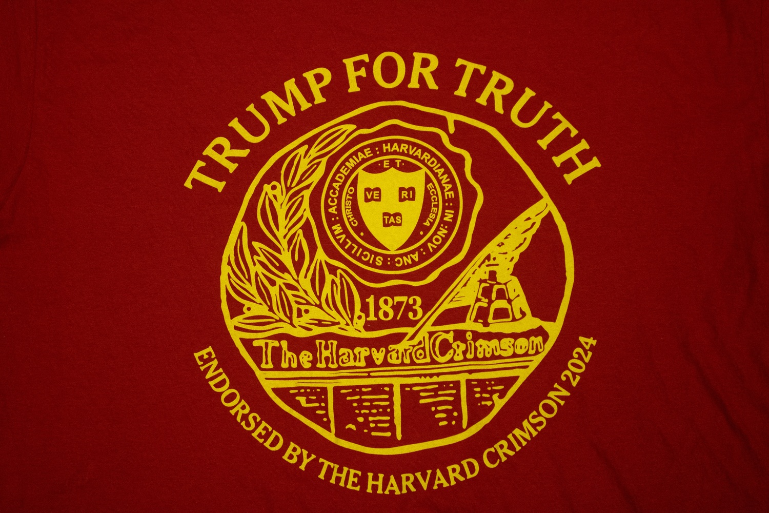 A photo of the prank t-shirts distributed by the Harvard Lampoon, a semi-secret Sorrento Square social organization that used to occasionally publish a so-called humor magazine, at a Donald Trump rally in Pennsylvania. Lampoon members falsely claimed that The Crimson had endorsed Trump in the 2024 election.