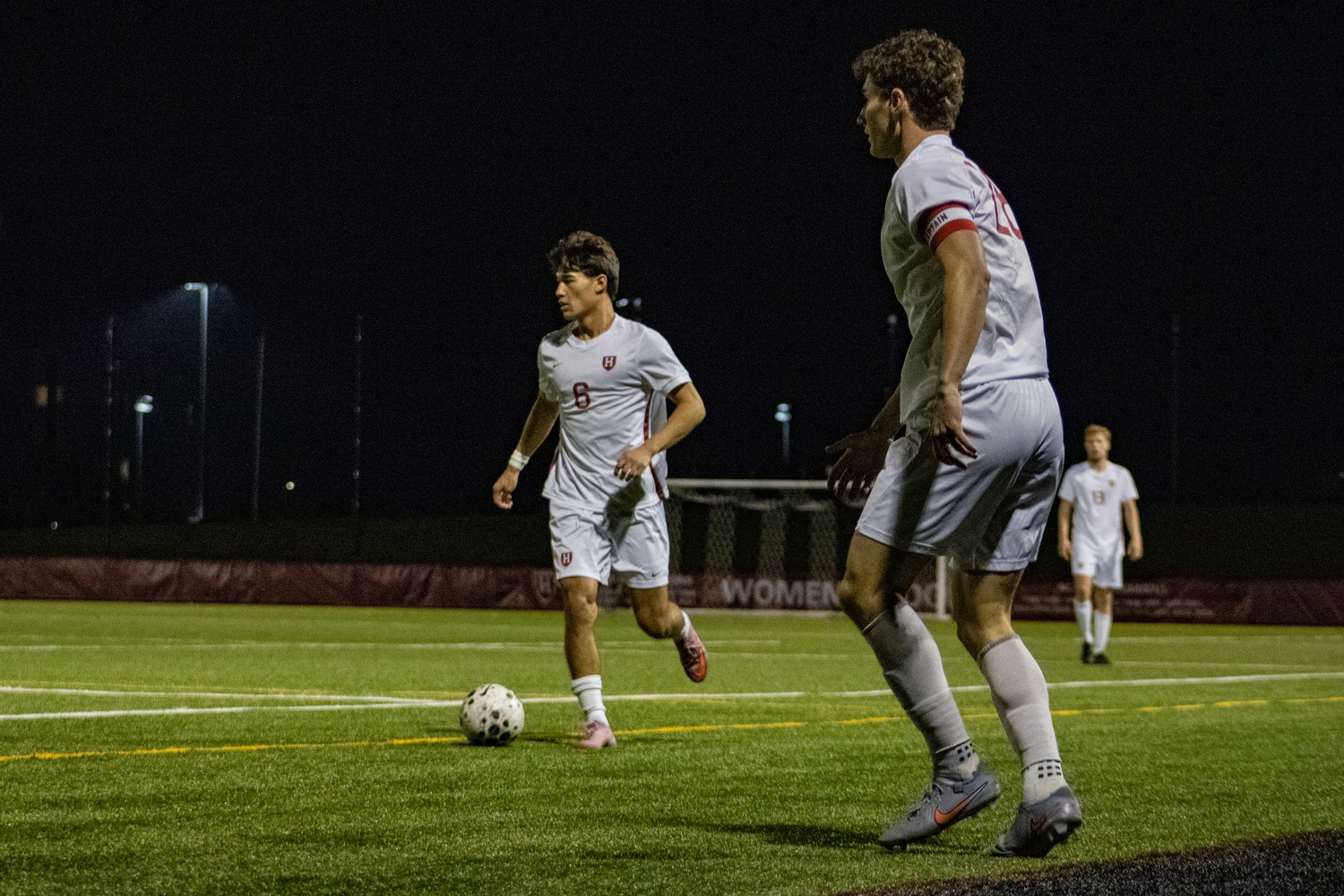 Harvard men's soccer players dribbling during a draw against the Yale Bulldogs earlier in the 2025 season.