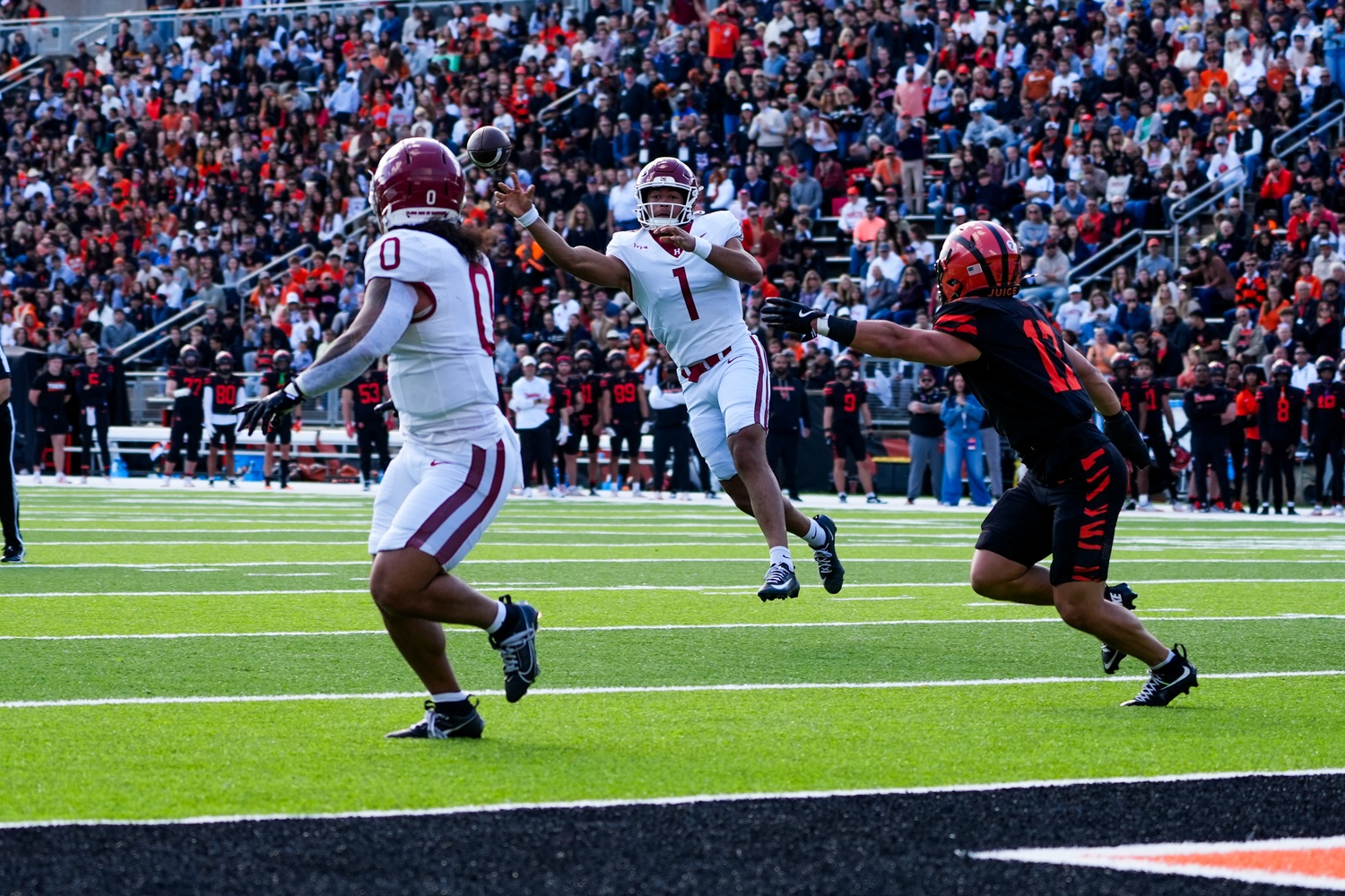 Senior quarterback Jaden Craig passes to junior Xaviah Bascon in the red zone.