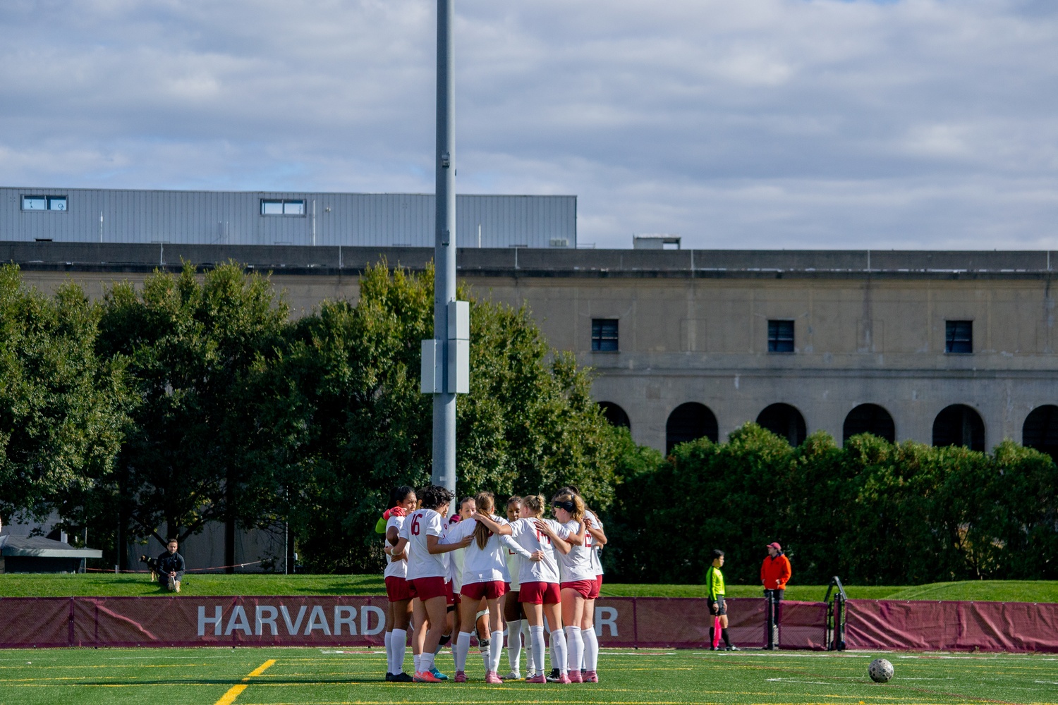 The women's soccer team huddles during a matchup against Penn in the 2025 season.