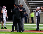 Harvard Coach Aurich and Princeton Coach Surace Hug