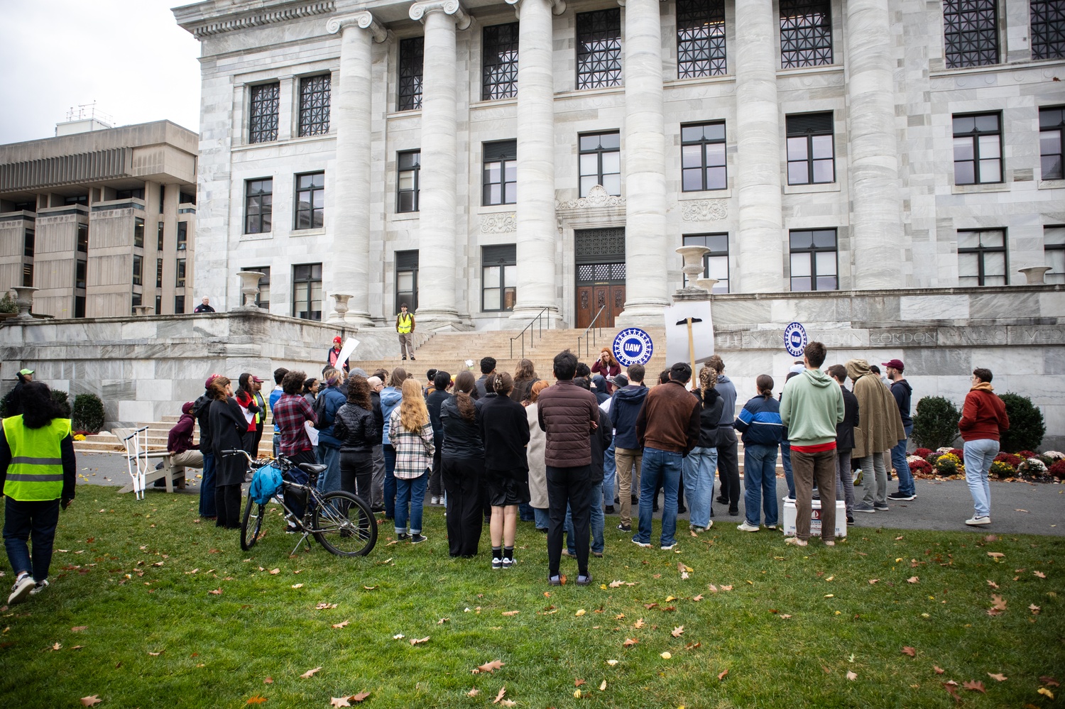 Demonstrators gathered in front of Gordon Hall at Harvard Medical School on Friday to protest the July removal of roughly 900 members from the University's graduate student union.
