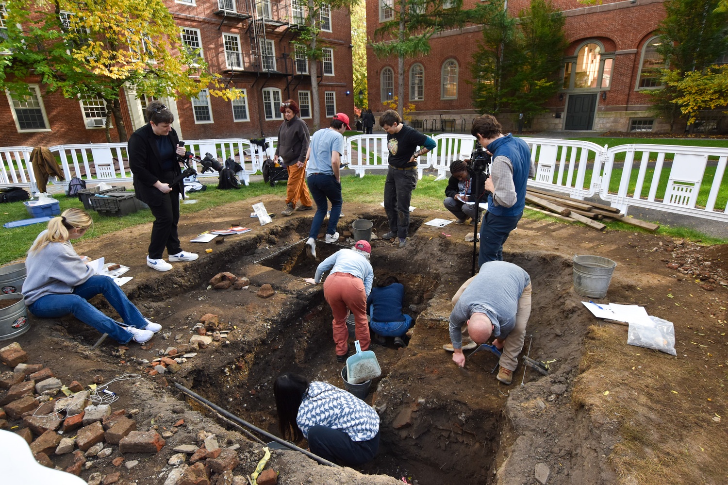 Harvard students perform an archeology dig in Harvard Yard.