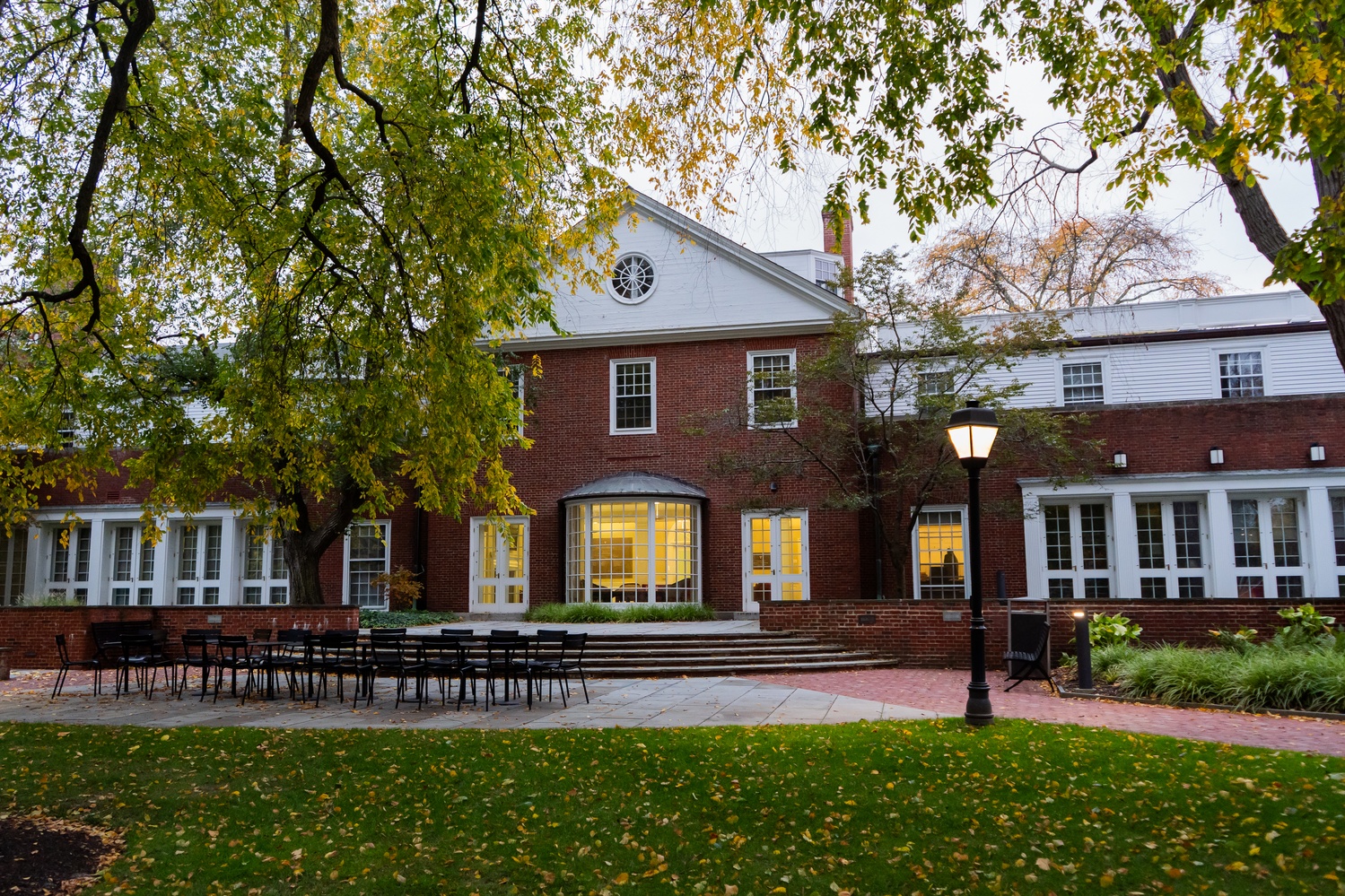 Sunlight fills the courtyard behind the Harvard College Admissions Office at 86 Brattle St.
