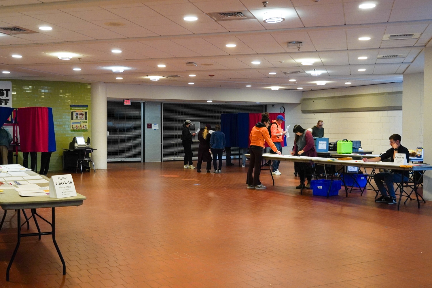 Voters inside of Cambridge Rindge and Latin School cast their ballots in the Tuesday election.
