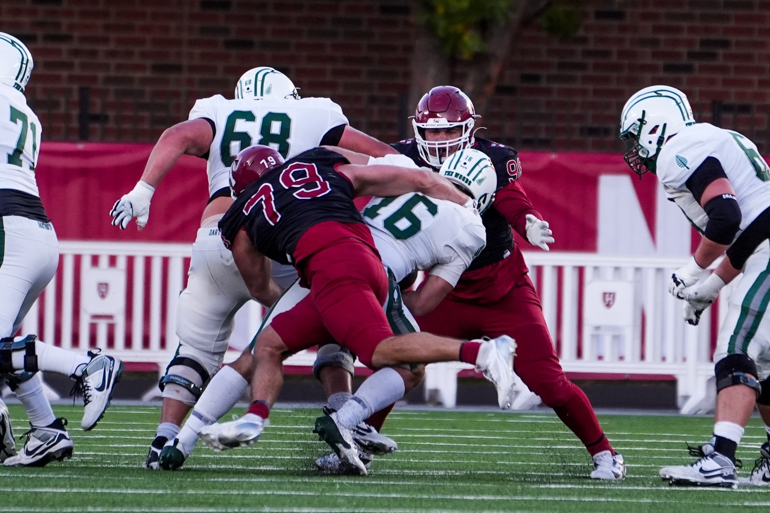 Senior defensive lineman Alex DeGrieck secures a critical sack against Dartmouth.