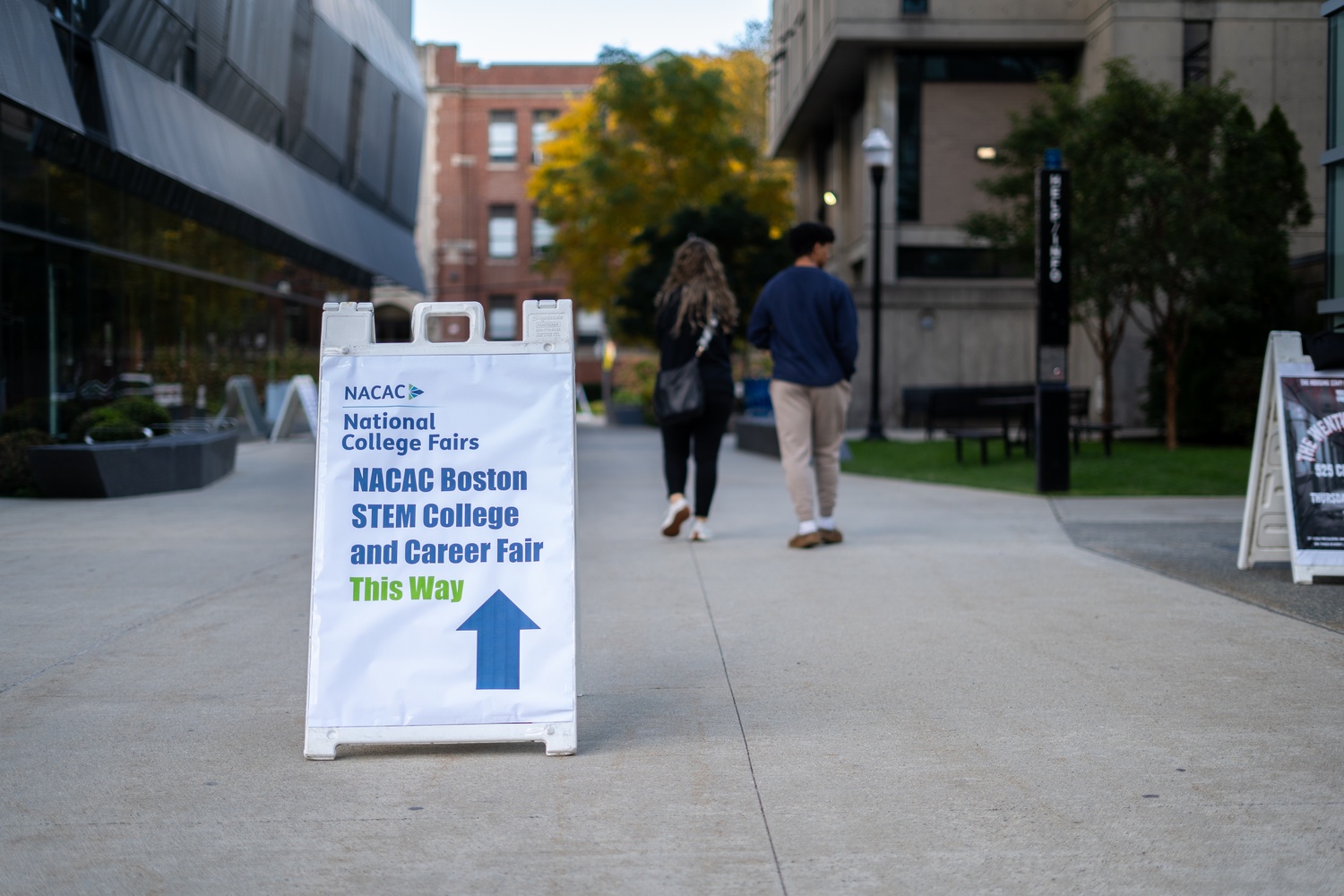 Signs at the National Association for College Admissions Counseling's fair