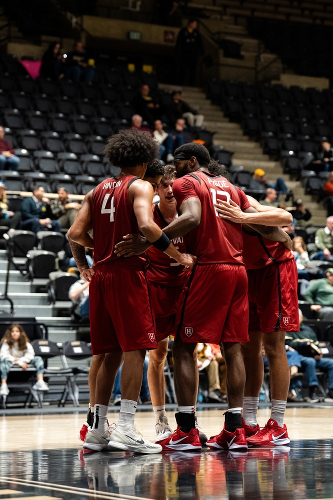 Harvard huddles up in the game against Army.