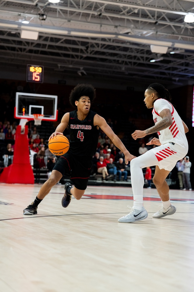 Sophomore Robert Hinton drives toward the basket during the team's game against Marist. 