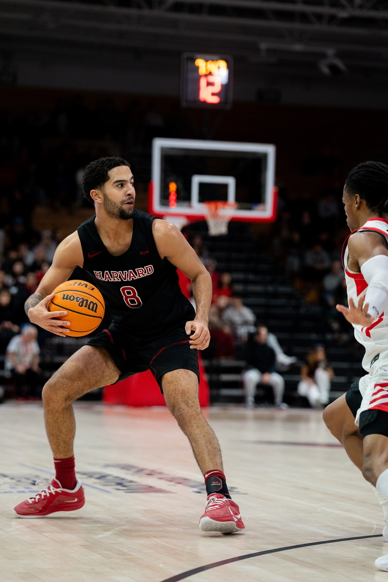 Tey Barbour Protects The Basketball From Marist Defender