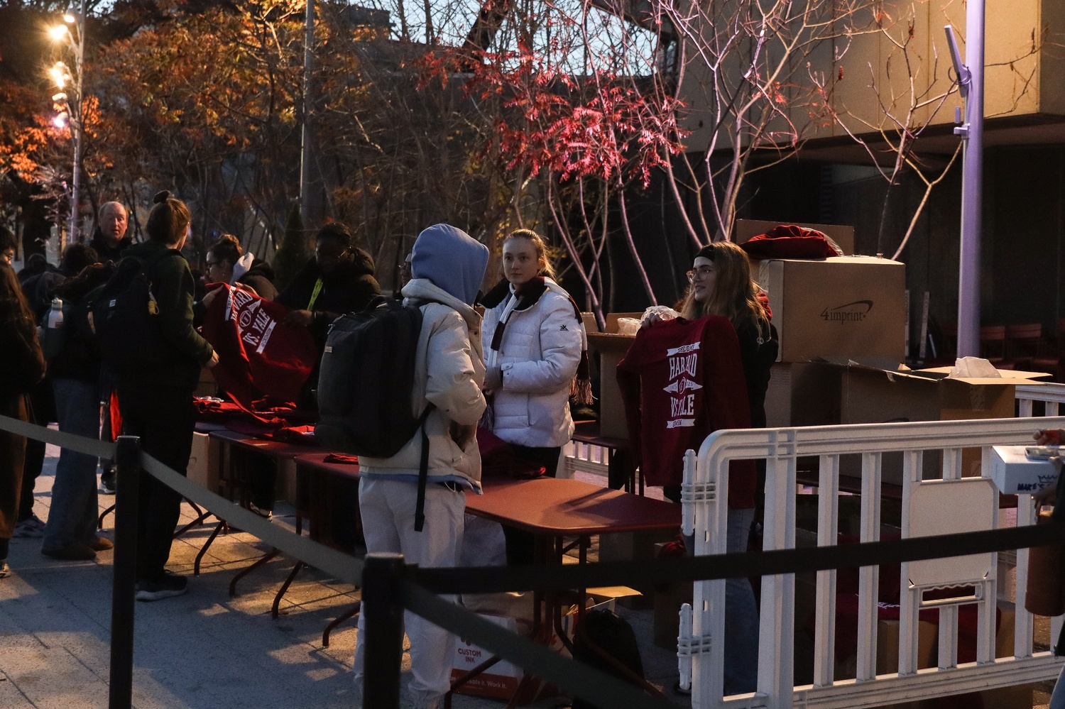 Students line up for free Harvard-Yale merchandise provided by the College Events Board Tuesday afternoon.