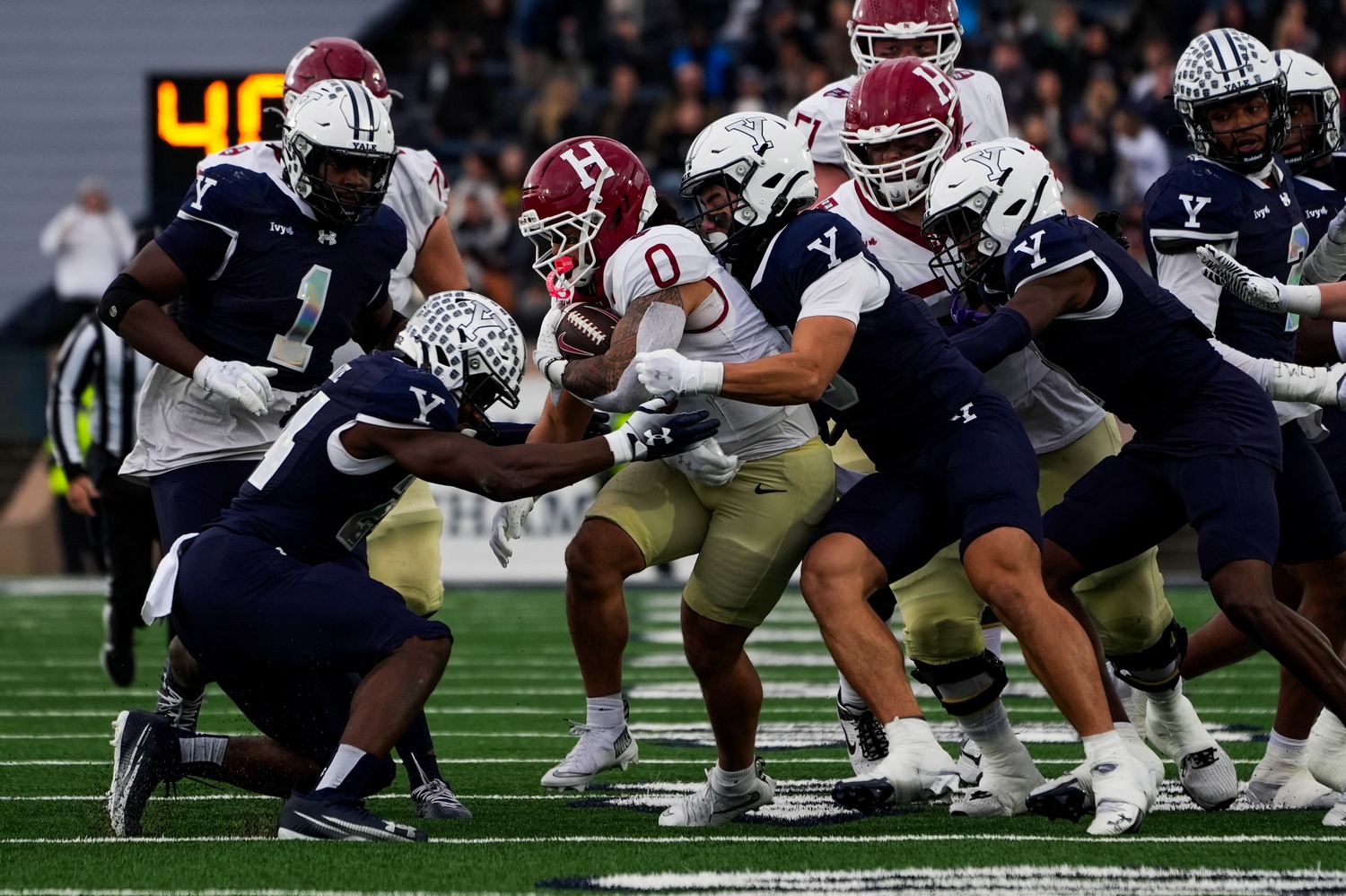 Junior Xaviah Bascon rushes through Yale's defense. Bascon provided some of the few moments of momentum for the Harvard.