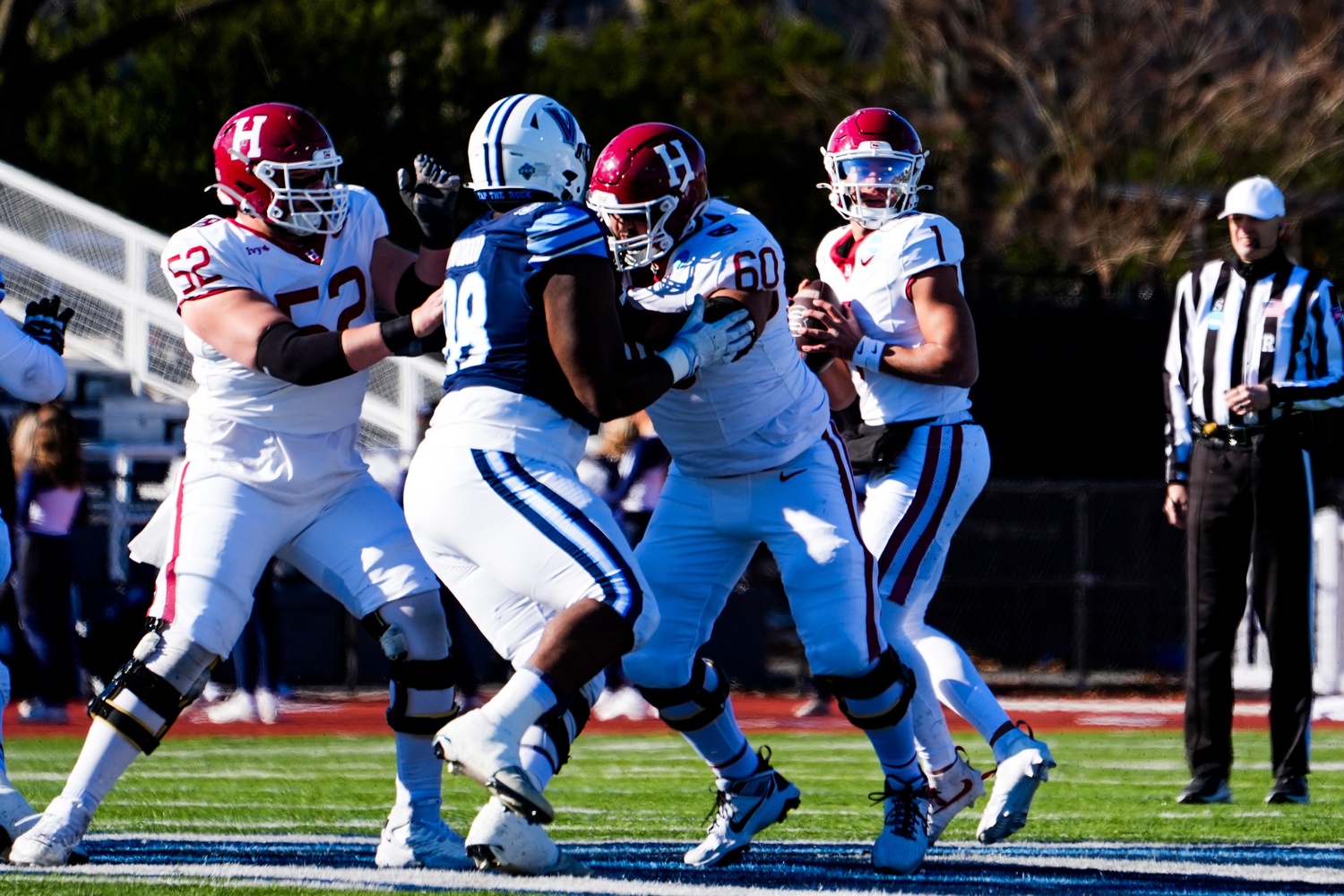 Senior quarterback Jaden Craig looks for a receiver down field. The quarterback struggled with sacks and butter-fingered receivers throughout the game,