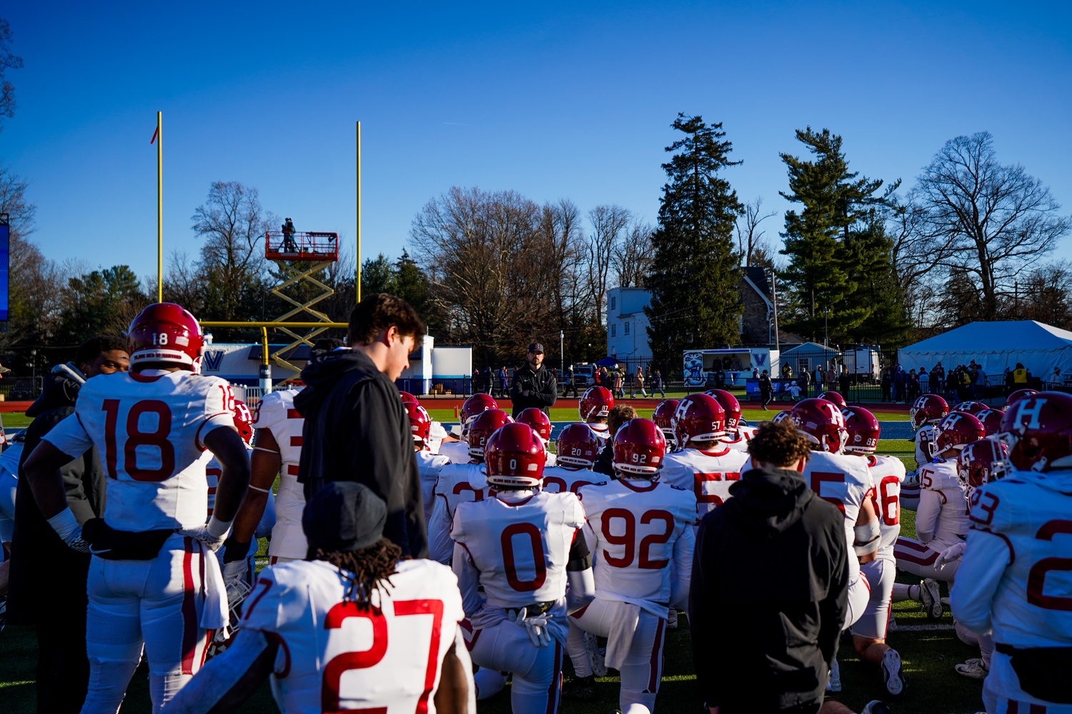 Head Coach Andrew Aurich speaks to the team after its blowout loss against Villanova in the first round of the FCS playoffs.