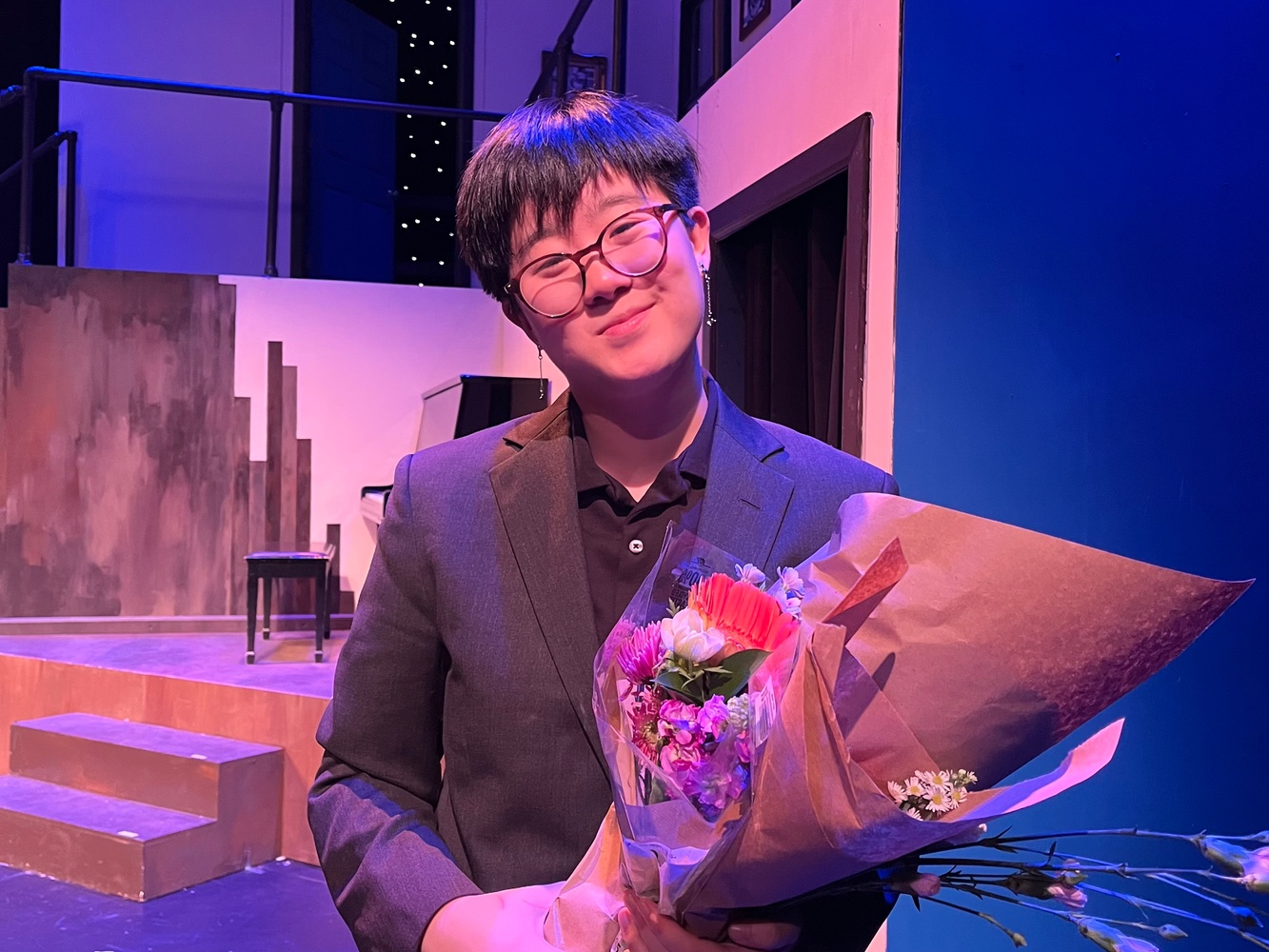 AJ Yi '25-'26 on the set of "Merrily We Roll Along."