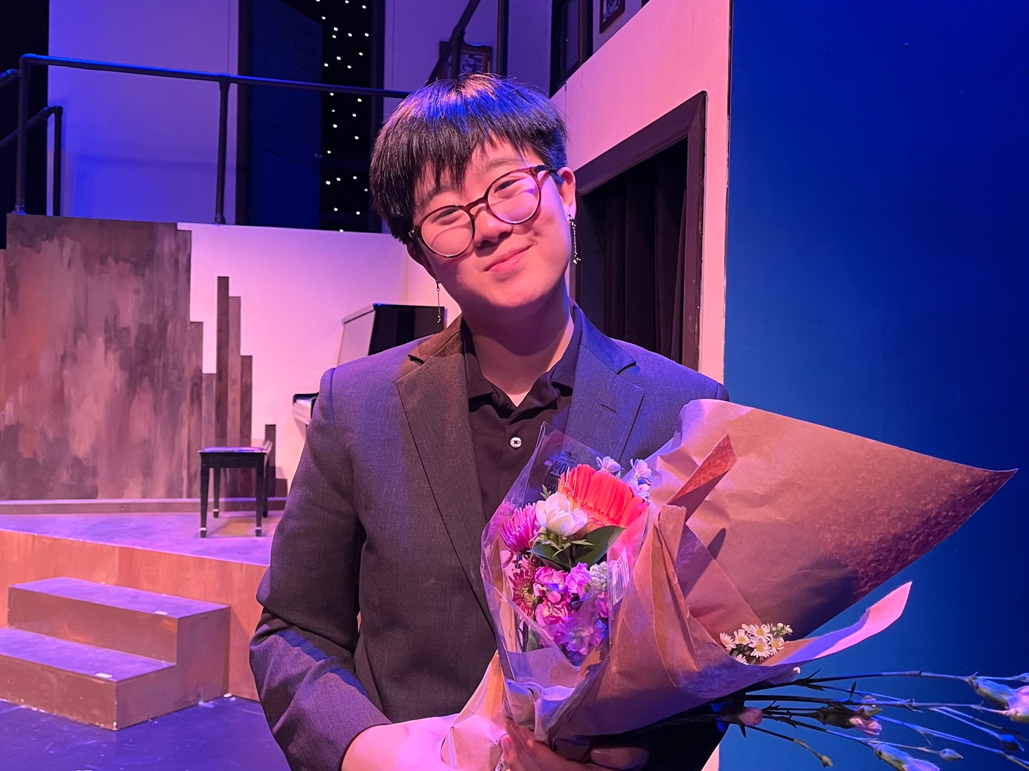 AJ Yi '25-'26 on the set of "Merrily We Roll Along."