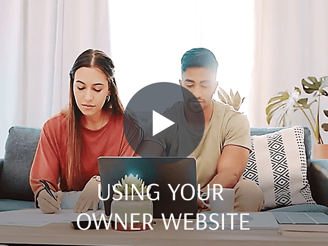 A couple sitting in their living room going over buisness matters.