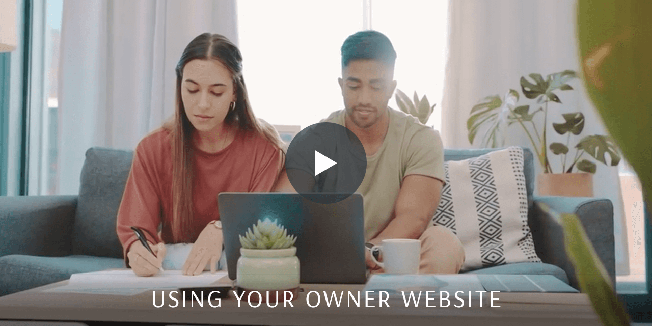A couple sitting in their living room going over buisness matters.