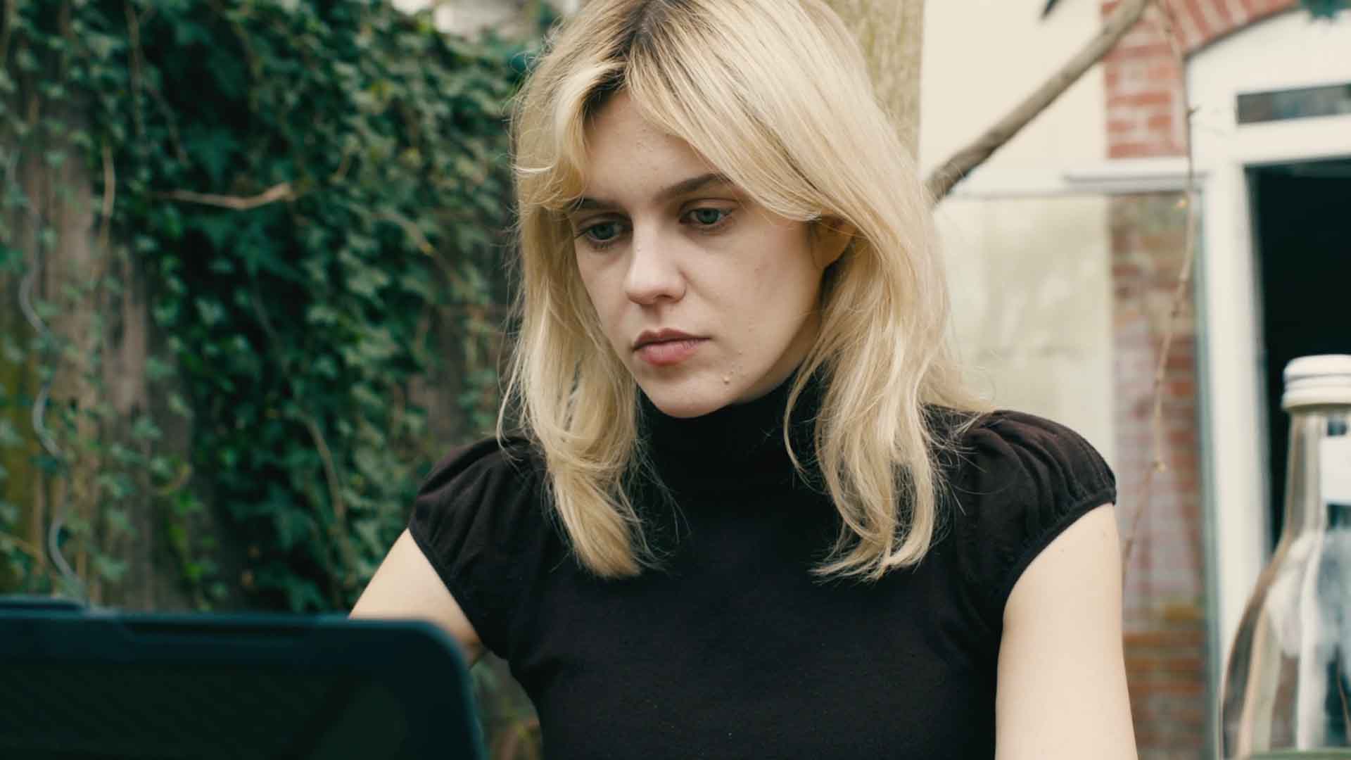 Anna Conkling works at her laptop