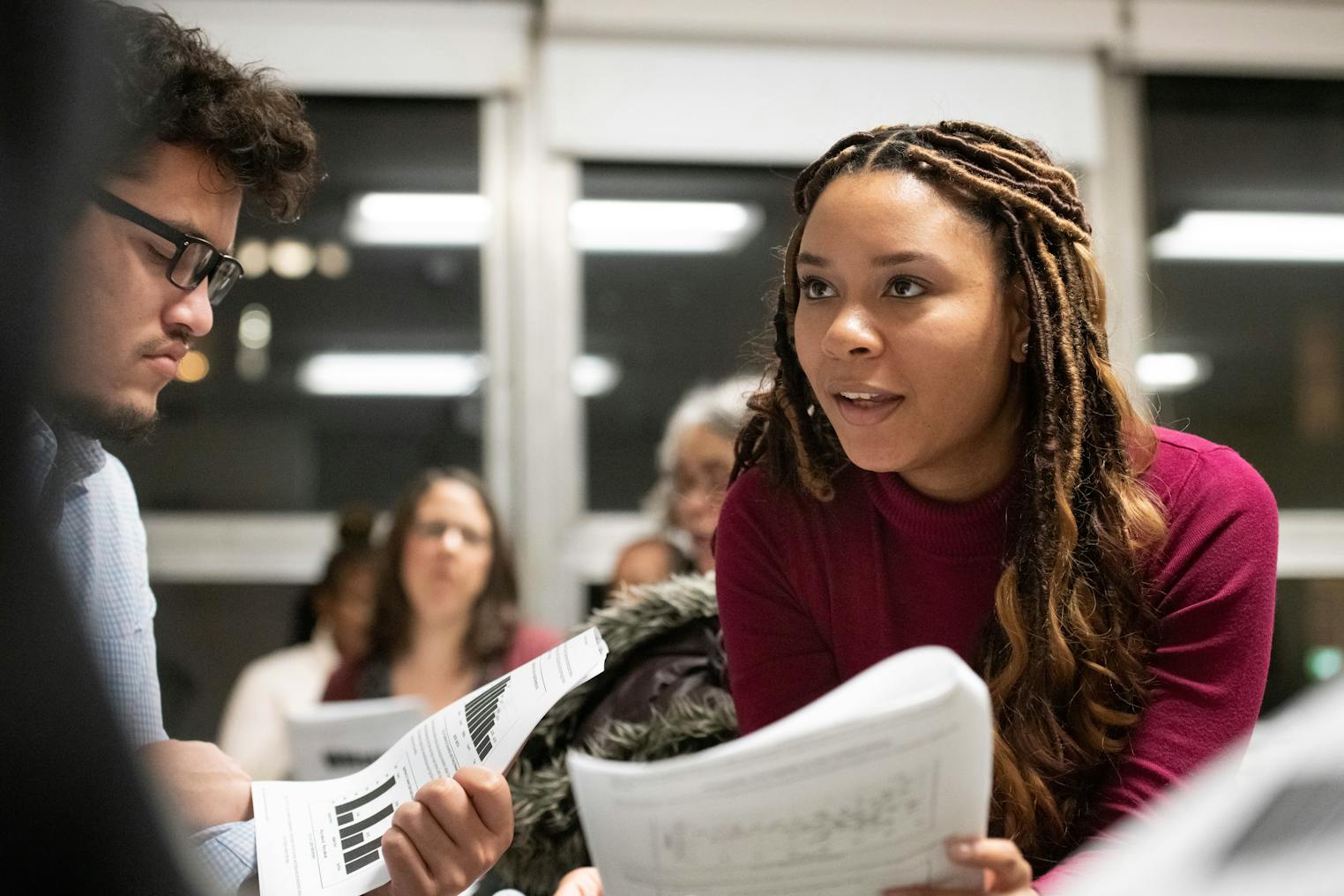 Students talk in a classroom