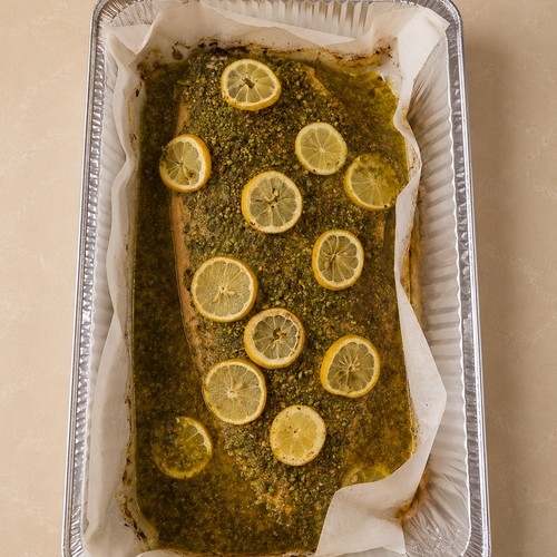 Whole salmon fillet with herbs, pistachio, and pomegranate