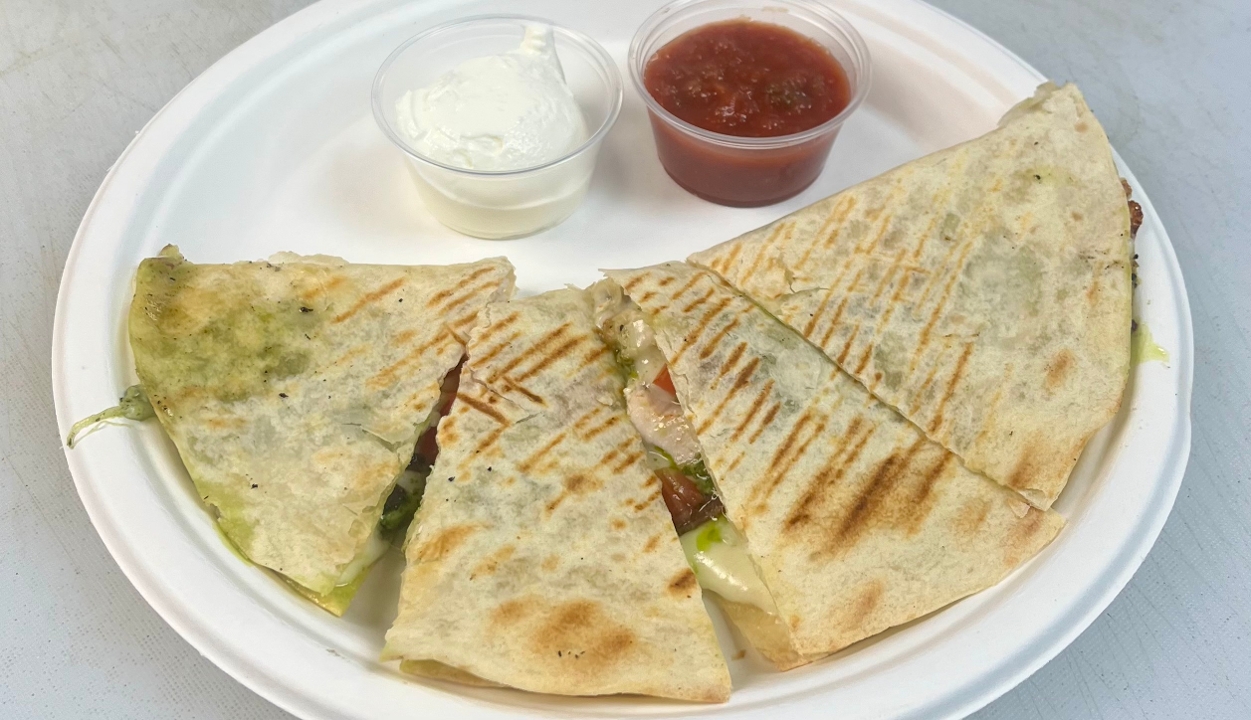 A visualization of the menu item "Pesto Chicken Dilla"