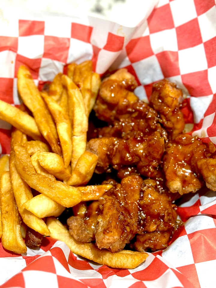 HONEY GARLIC CHICKEN FINGERS with fries and a soda