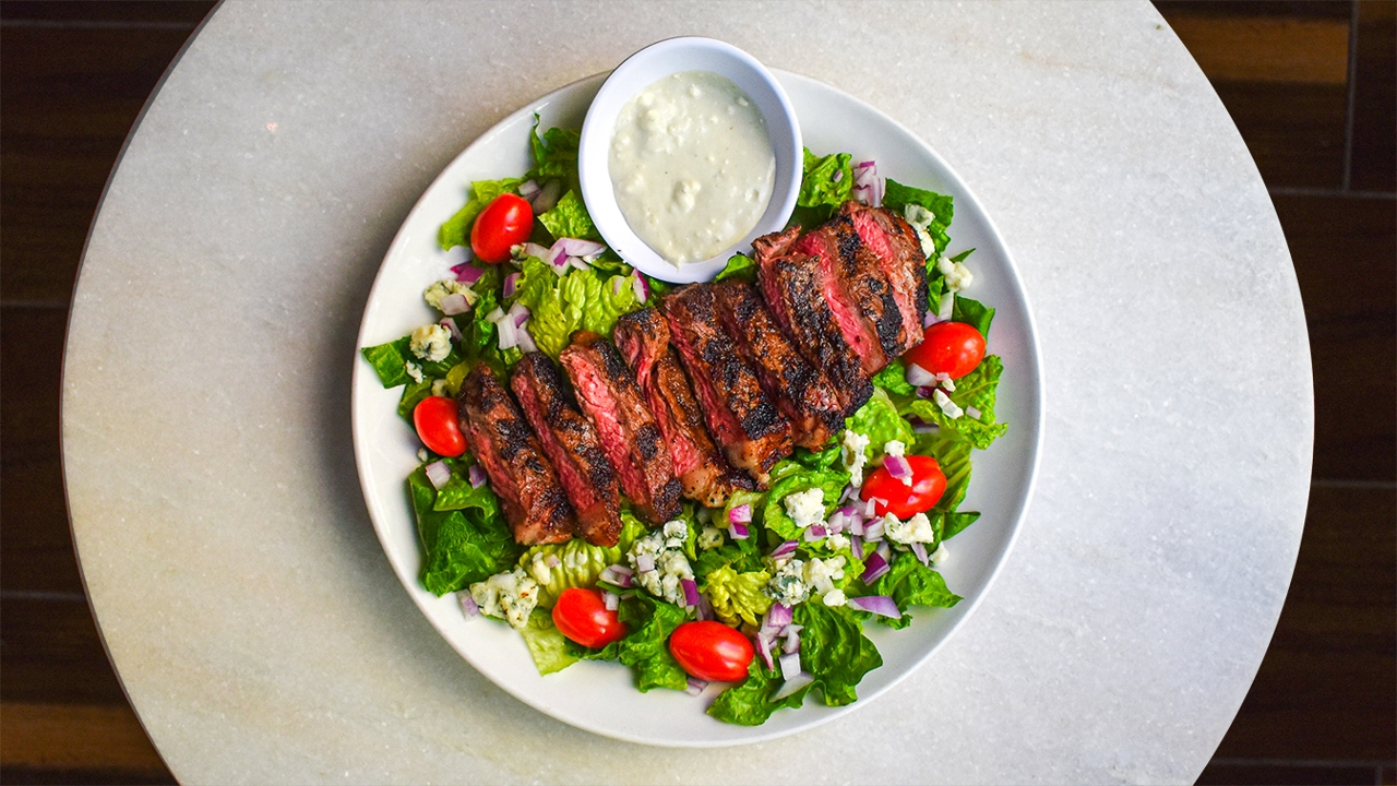 Order Sliced N.Y. Strip Salad food online from Carson's Prime Steaks and Famous Barbecue of Deerfield store, Deerfield on bringmethat.com