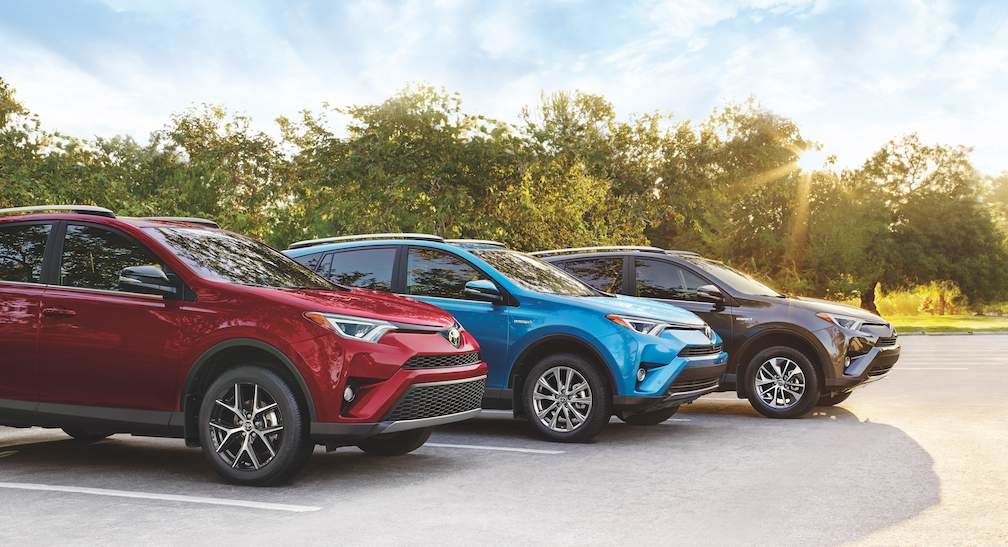 RAV4 SE in Ruby Flare Pearl. Hybrid Limited in Electric Storm Blue. Hybrid LE+ in Magnetic Grey Metallic