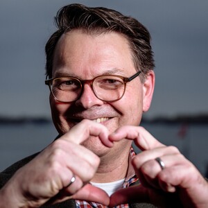 Moe smiling with heart gesture (cropped sample)   moe poirier