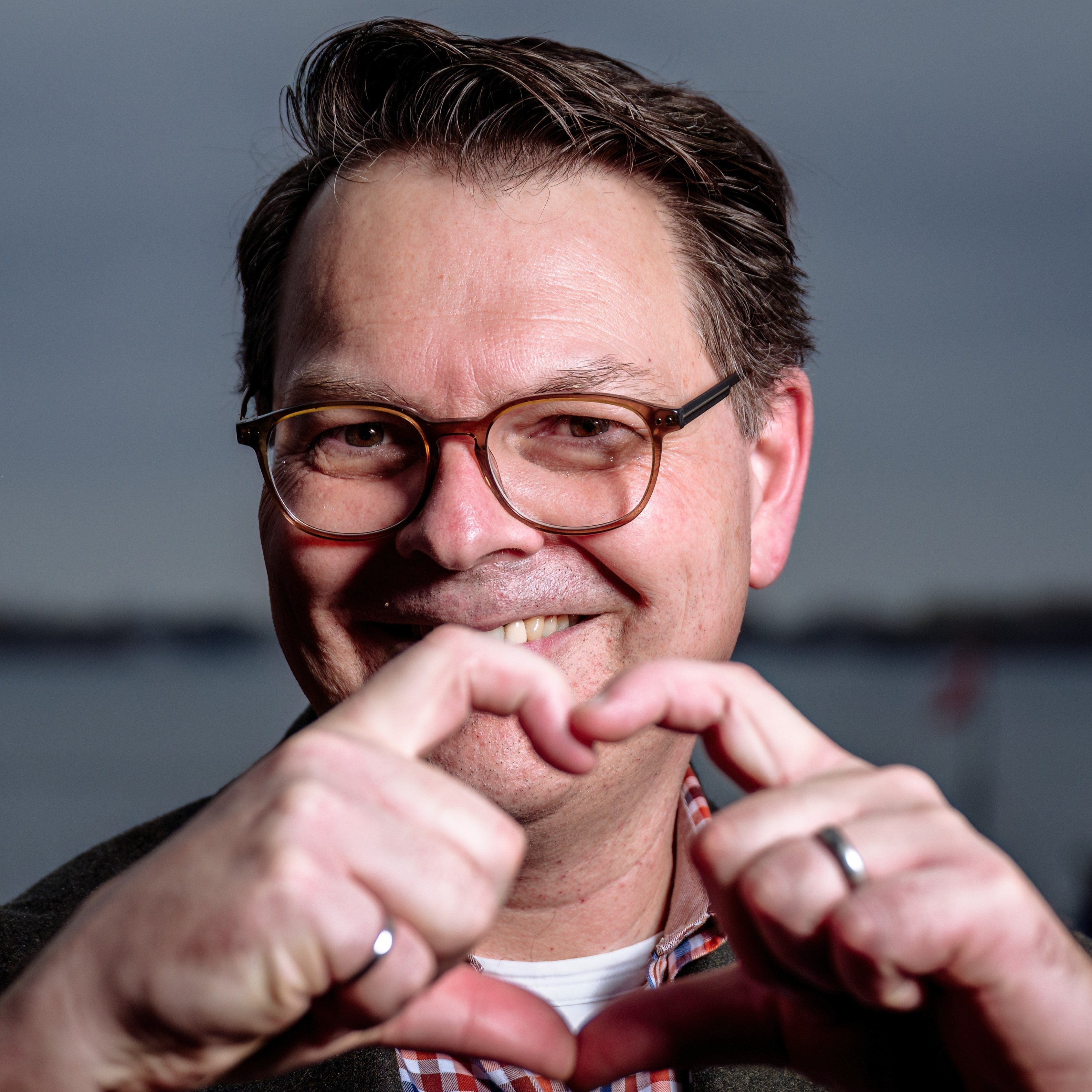 Moe smiling with heart gesture (cropped sample)   moe poirier