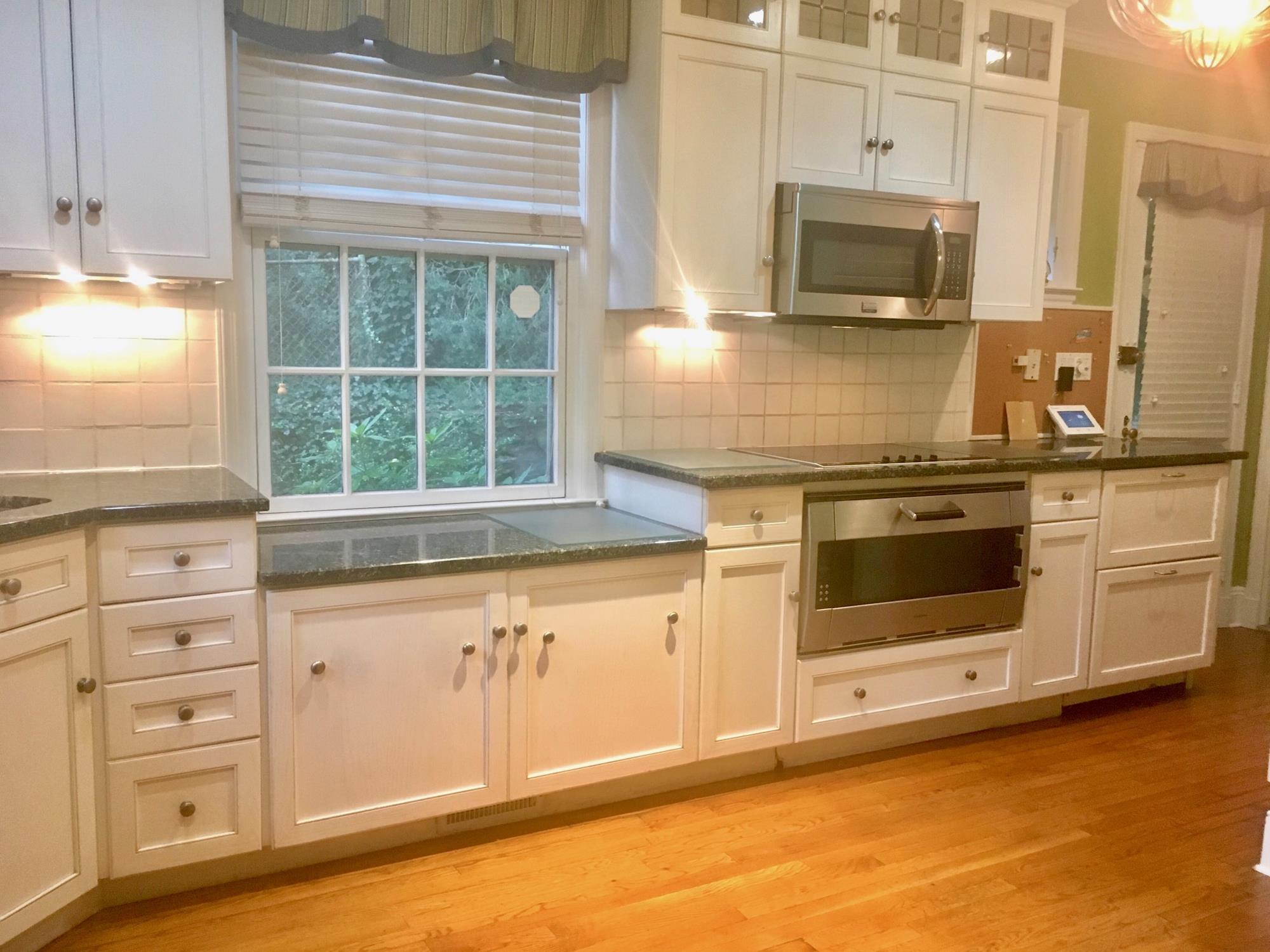 BRICK COLONIAL-STYLE HOUSE w/ TERRACE: 4-Bd., 3.5-Bath House in Rivedale Estate Area West of the Henry Hudson Pkwy.  Features include an entry hall; living room w/ fireplace & French door to flagstone terrace; formal dining room; windowed kitchen w/ granite countertops; master bedroom suite; finished basement w/ fireplace; central air-conditioning; private 2-car driveway; attached 2-car garage. Close to Wave Hill public garden & culture center, Metro-North trains, & express buses to Manhattan.